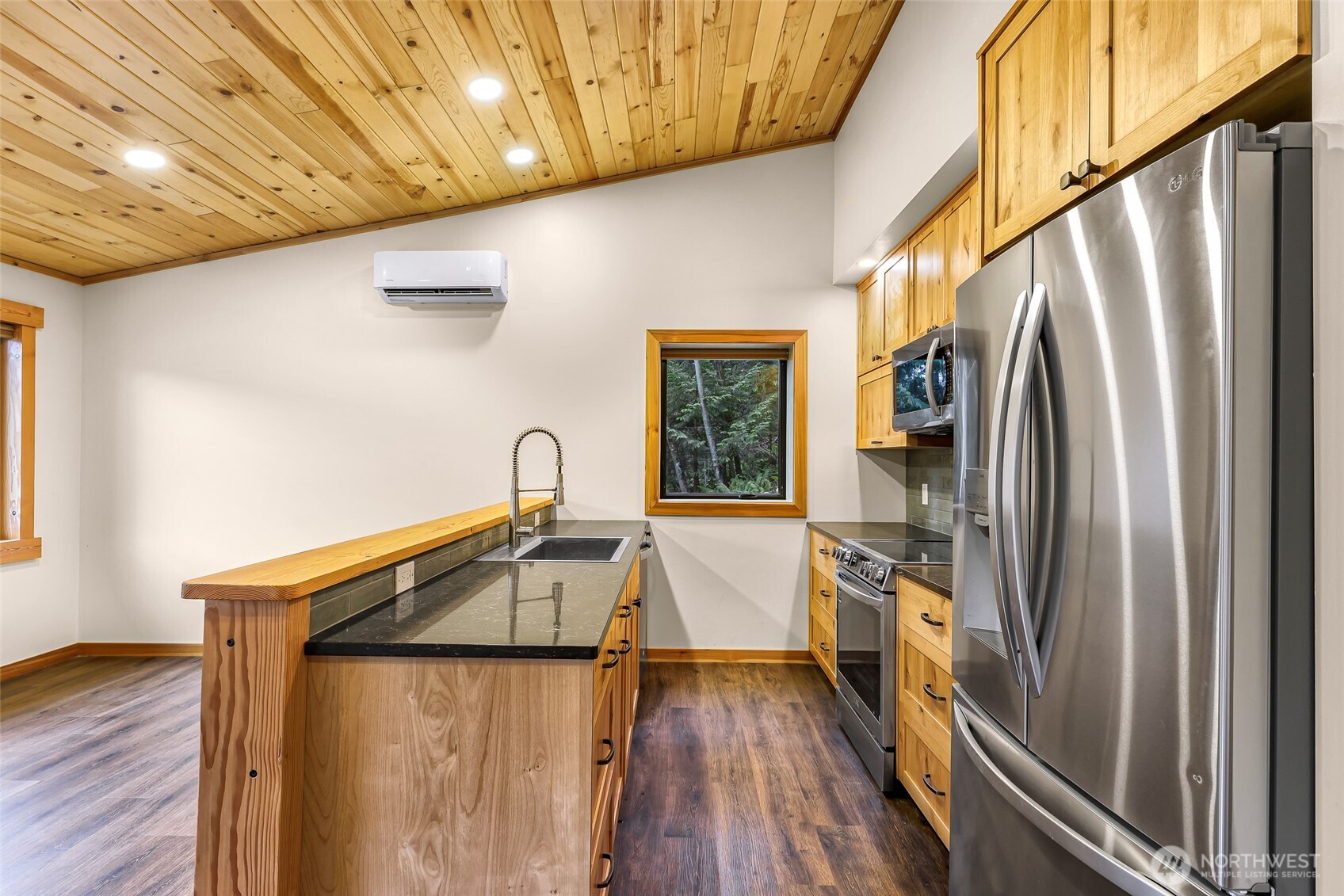 1693 Pebble Beach Trail Bellingham, WA 98226 - Photo 11 of 33 a kitchen with stainless steel appliances granite countertop a refrigerator and a sink
