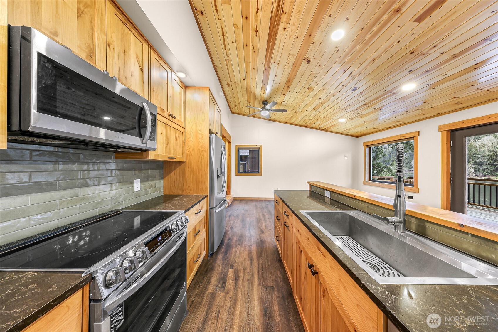 1693 Pebble Beach Trail Bellingham, WA 98226 - Photo 13 of 33 a kitchen with stainless steel appliances granite countertop a sink and a stove