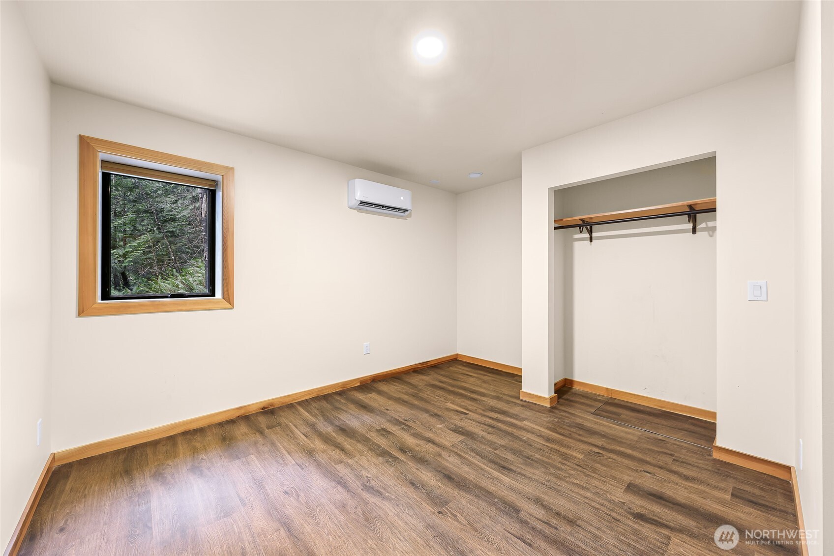 1693 Pebble Beach Trail Bellingham, WA 98226 - Photo 20 of 33 an empty room with wooden floor and a window