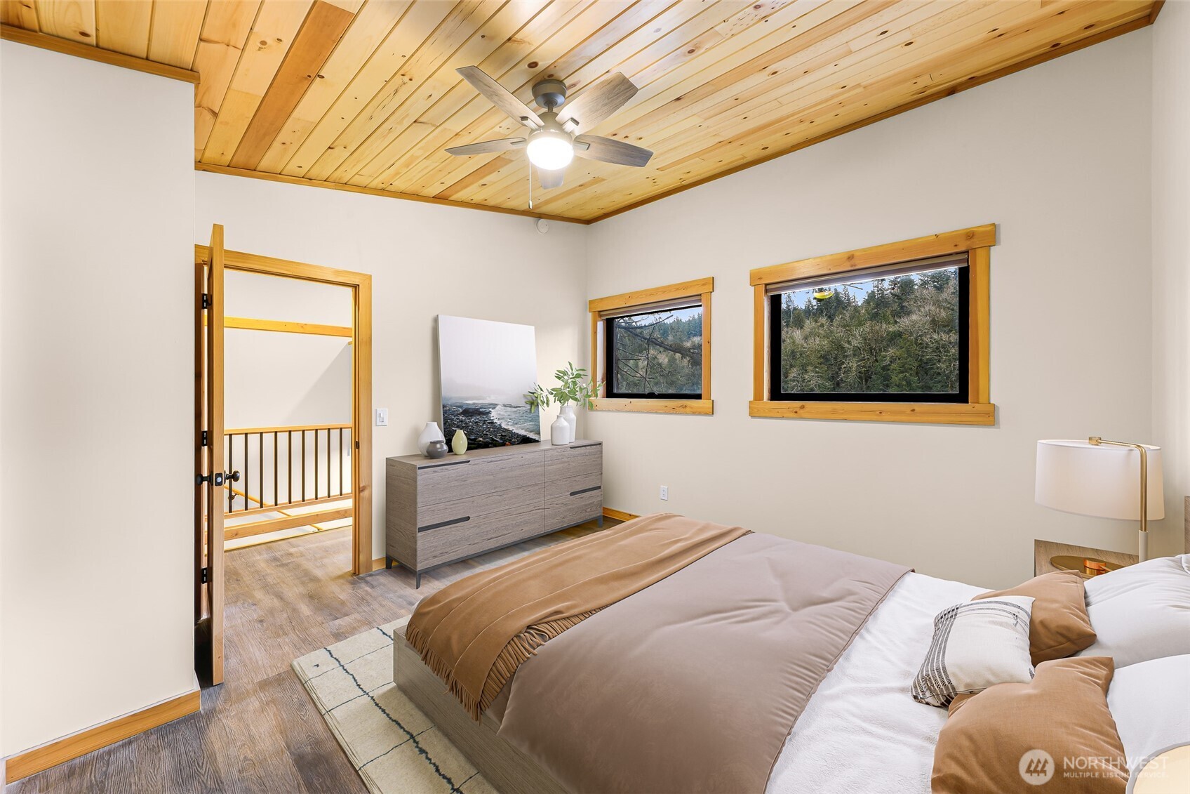1693 Pebble Beach Trail Bellingham, WA 98226 - Photo 25 of 33 a bedroom with a large bed a chandelier and dresser