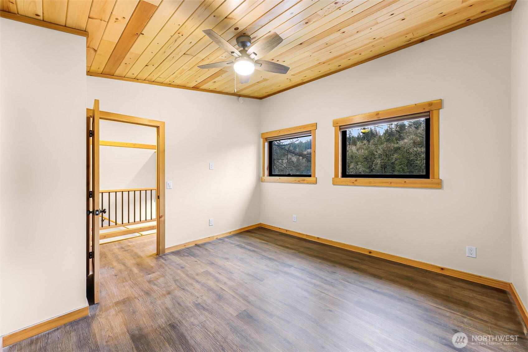 1693 Pebble Beach Trail Bellingham, WA 98226 - Photo 26 of 33 an empty room with wooden floor and windows