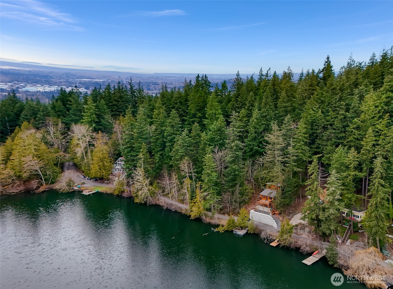 1693 Pebble Beach Trail Bellingham, WA 98226 - Photo 30 of 33 a view of a lake with a yard and large trees
