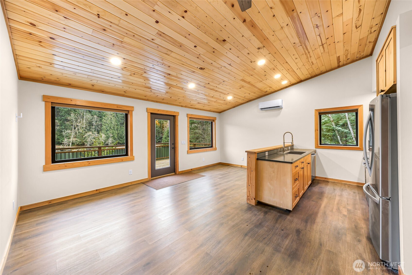 1693 Pebble Beach Trail Bellingham, WA 98226 - Photo 10 of 33 a view of an empty room with wooden floor and a window