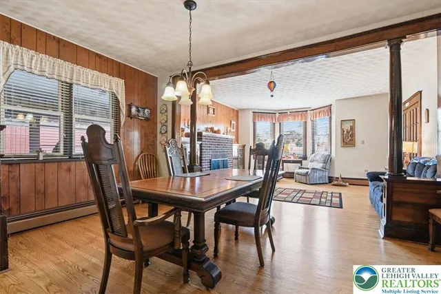 a view of a dining room with furniture window and outside view