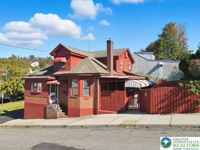 a front view of a house with street