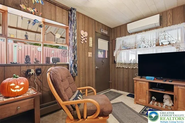 a room with furniture and flat screen tv