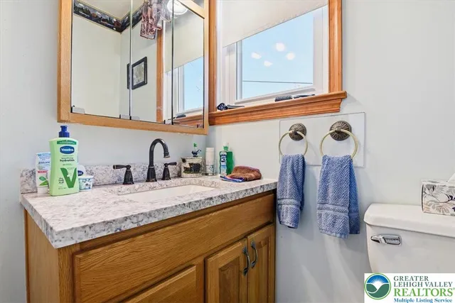 a view of a hallway with wooden floor and stairs