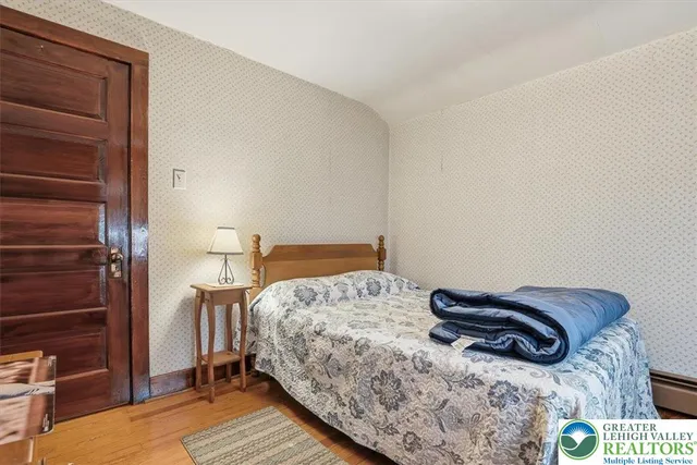 a view of storage and utility room with racks on the wall