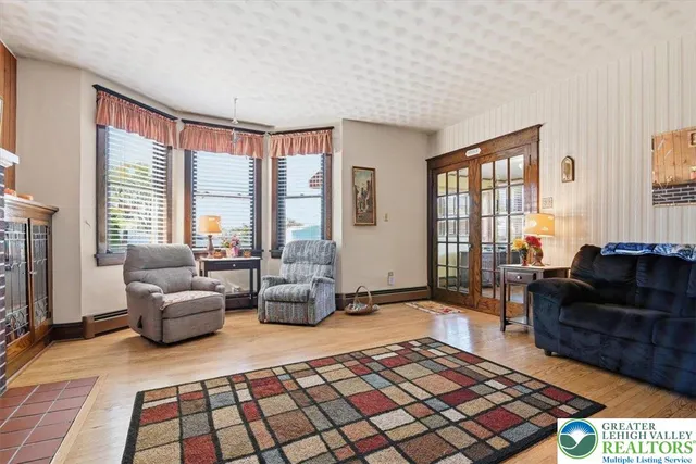 a living room with furniture and a rug