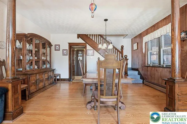 a view of entryway livingroom and hall with wooden floor