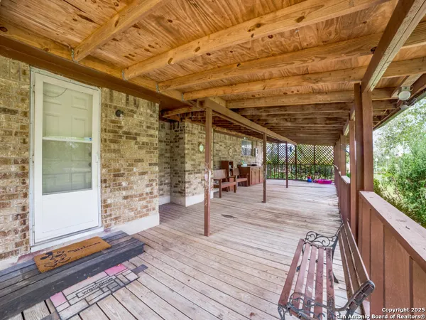 a view of a patio with wooden floor