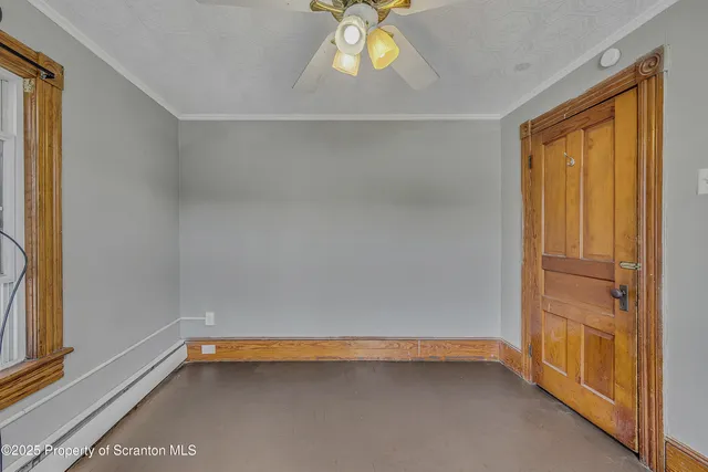 a view of room with window and carpet