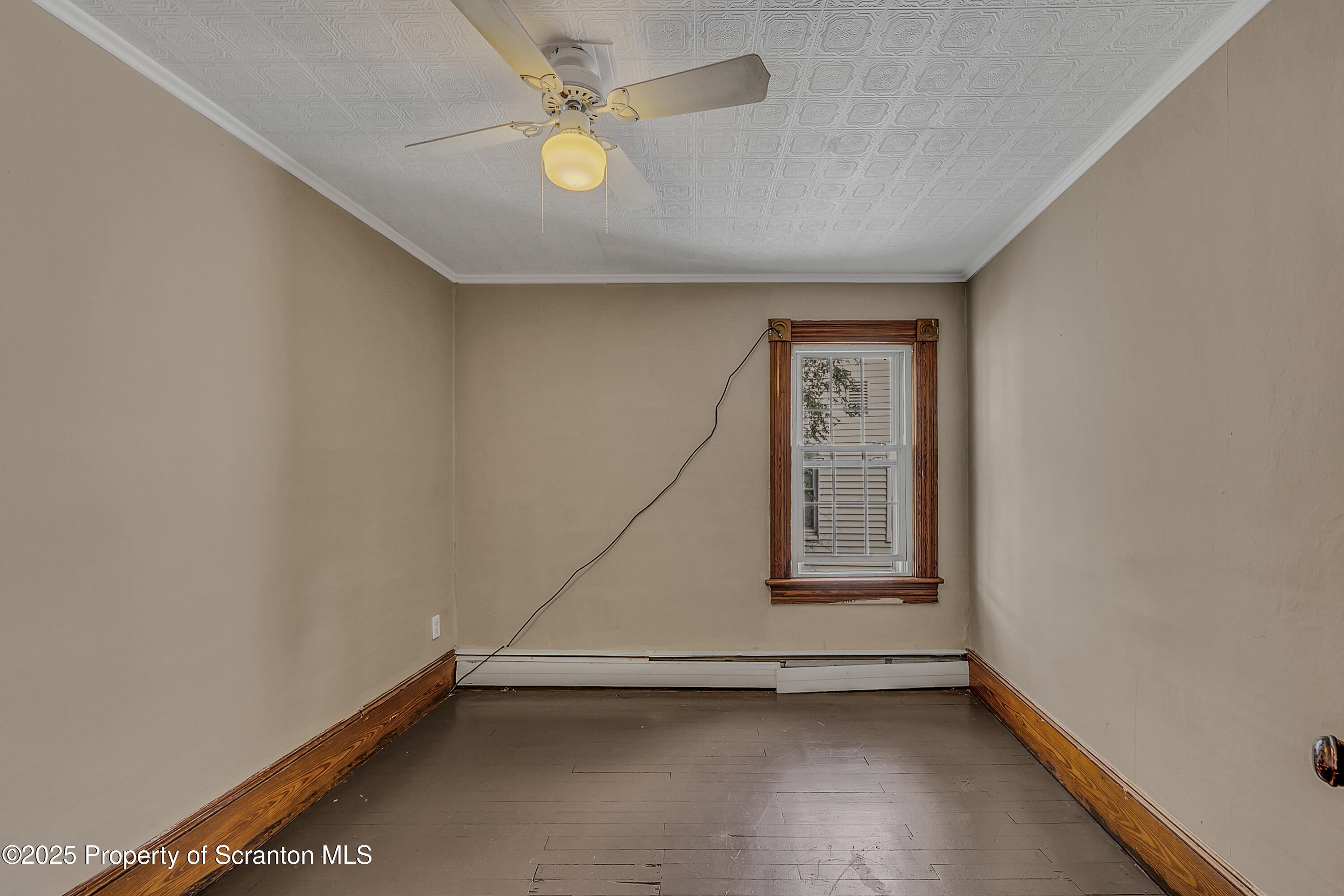 1202 Main Street Dickson City, PA 18519 - Photo 14 of 30 an empty room with windows and fan