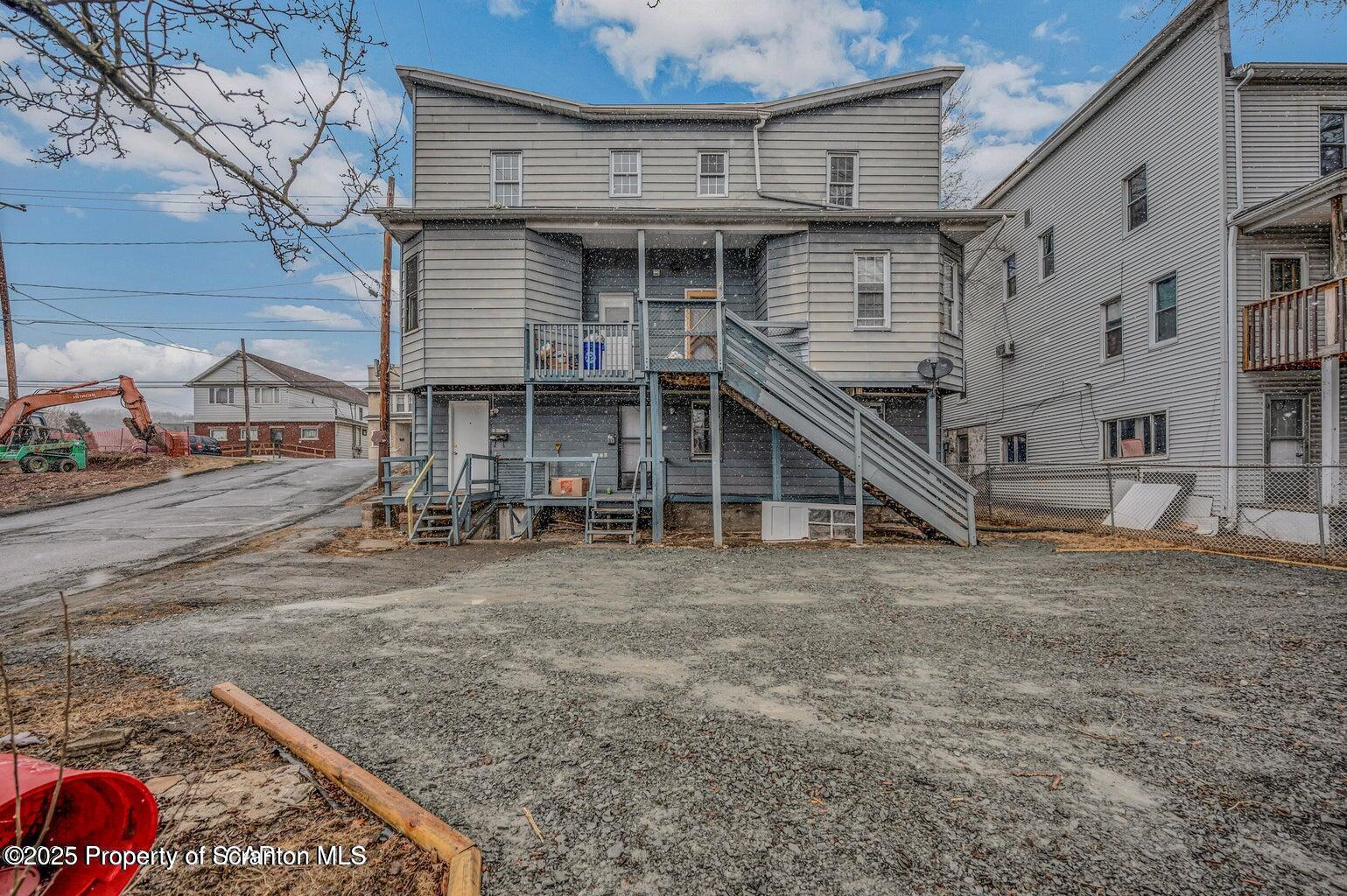 1202 Main Street Dickson City, PA 18519 - Photo 22 of 30 a view of a house with wooden deck