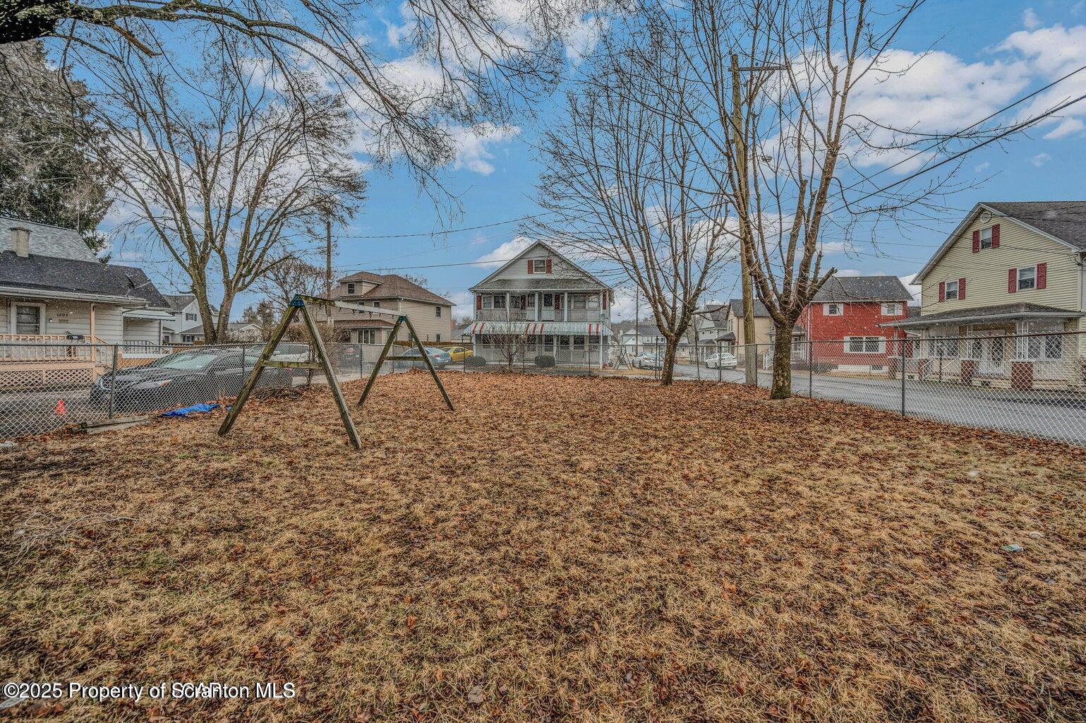 1202 Main Street Dickson City, PA 18519 - Photo 24 of 30 a front view of a house with a yard