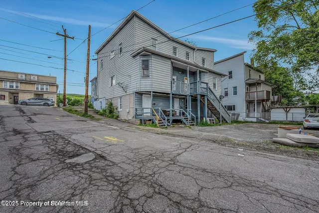 a view of a house with a street