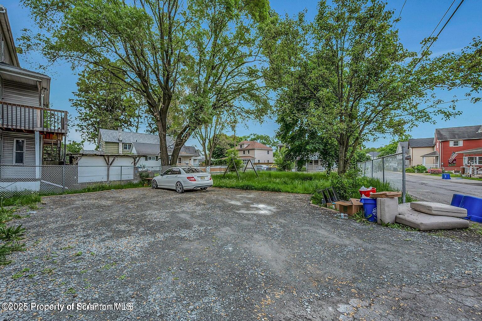 1202 Main Street Dickson City, PA 18519 - Photo 27 of 30 a green field with trees in the background