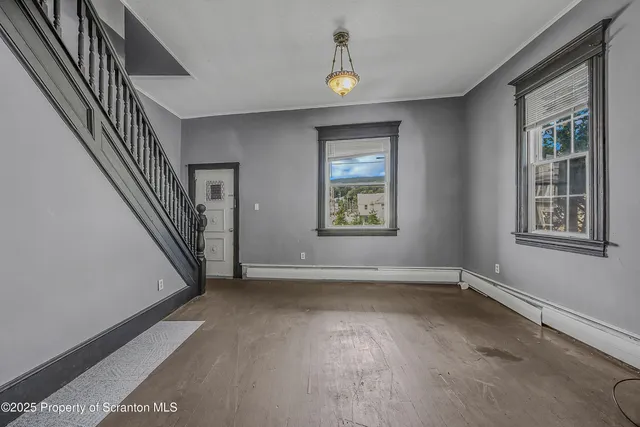a view of an empty room with a window