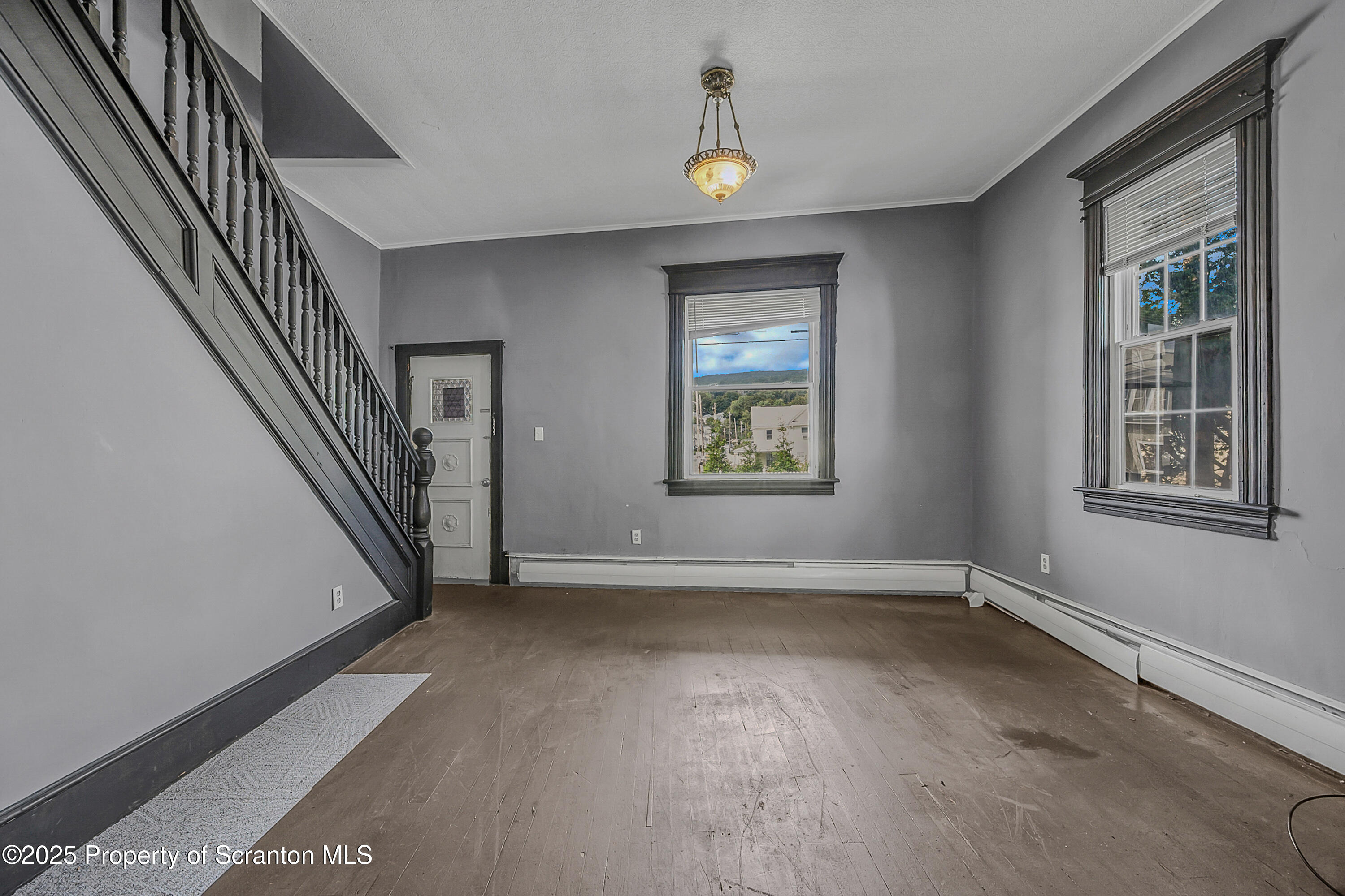 1202 Main Street Dickson City, PA 18519 - Photo 3 of 30 a view of an empty room with a window