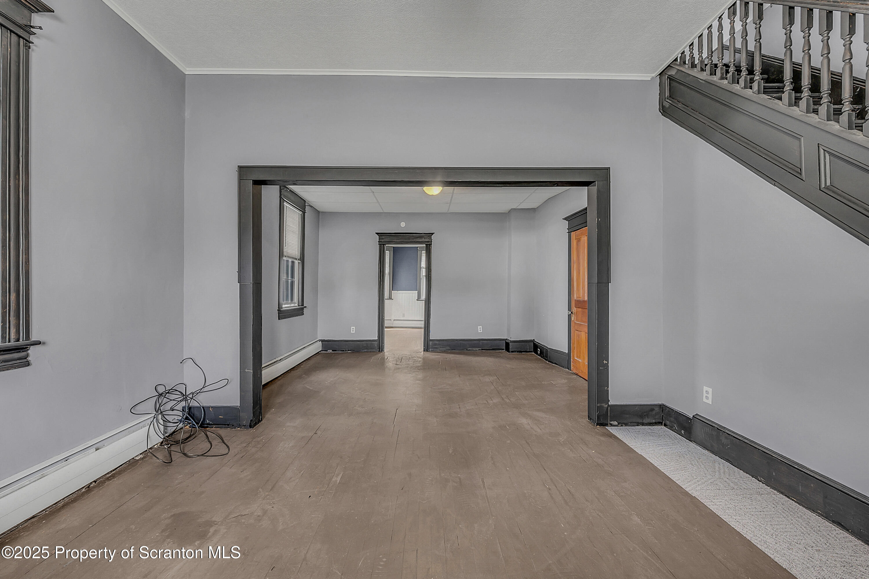 1202 Main Street Dickson City, PA 18519 - Photo 5 of 30 a view of a livingroom with a staircase