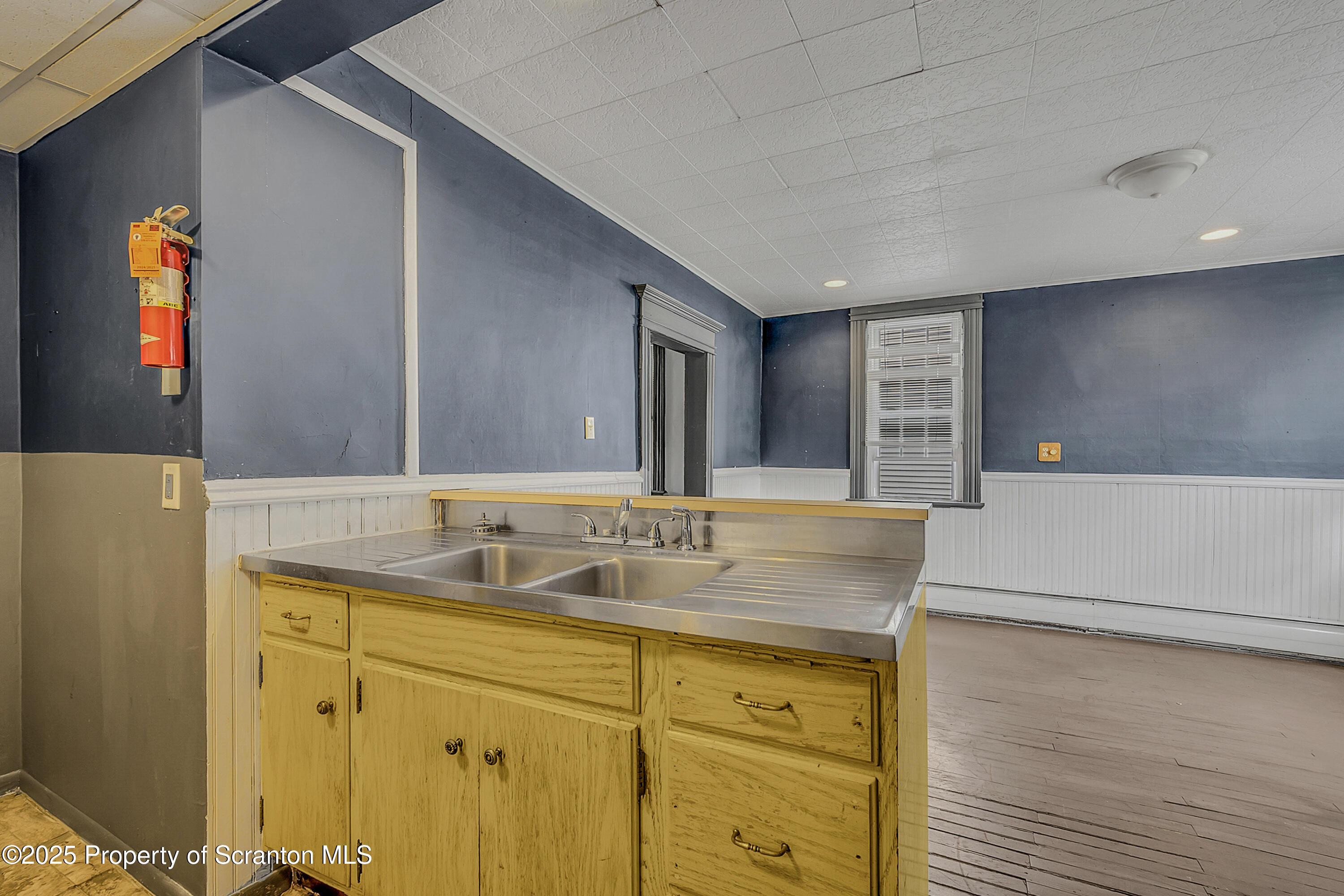 1202 Main Street Dickson City, PA 18519 - Photo 10 of 30 a bathroom with a granite countertop sink and a mirror