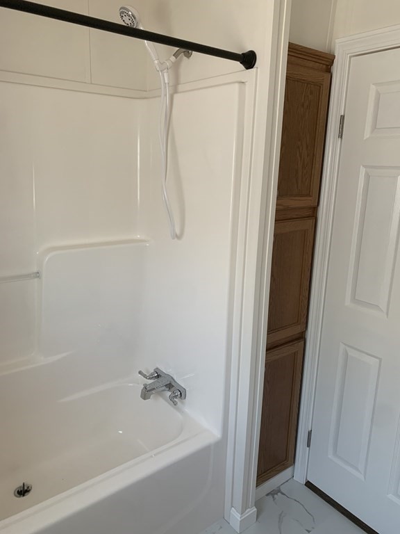 557 Southwest Cutoff, Unit 38 Worcester, MA 01607 - Photo 12 of 20 a bathroom with a shower and a bath tub