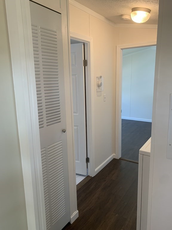 557 Southwest Cutoff, Unit 38 Worcester, MA 01607 - Photo 14 of 20 a view of a hallway with wooden floor