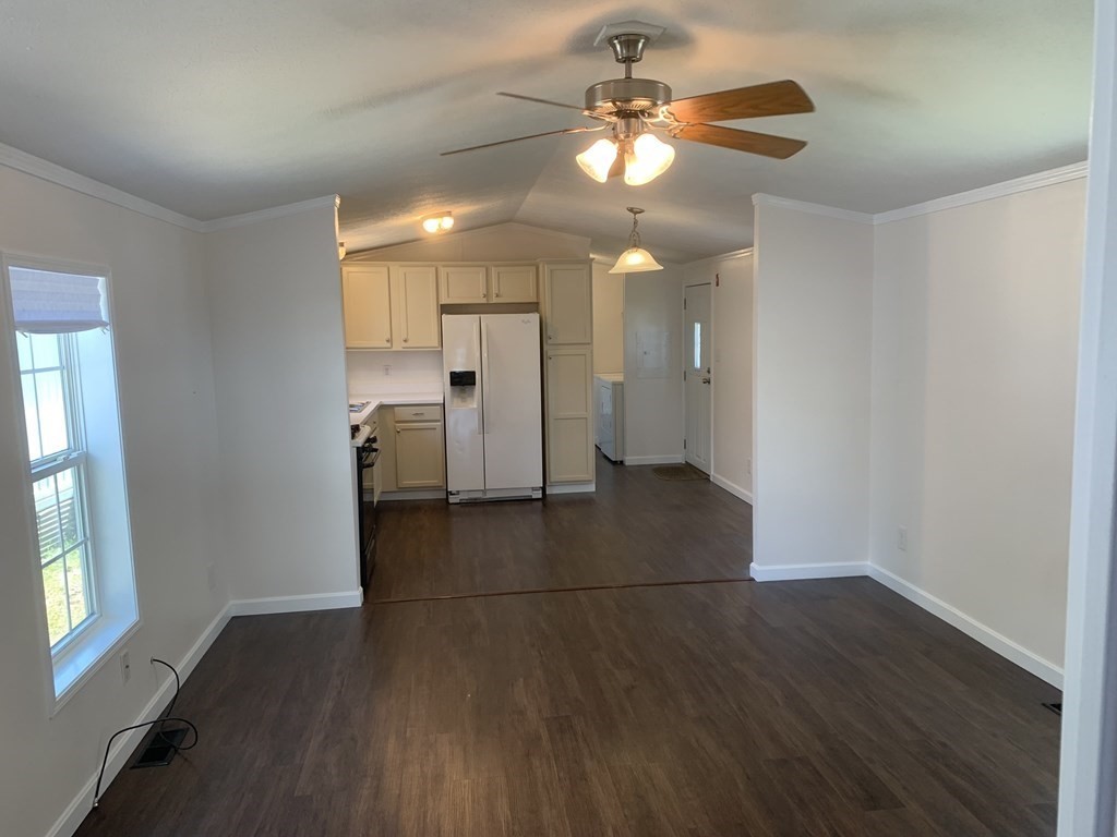 557 Southwest Cutoff, Unit 38 Worcester, MA 01607 - Photo 3 of 20 wooden floor in an empty room with a window
