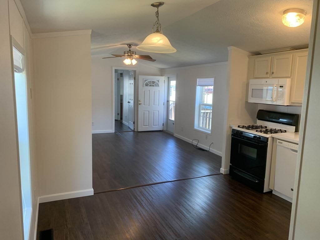 557 Southwest Cutoff, Unit 38 Worcester, MA 01607 - Photo 5 of 20 a view of a kitchen with an empty space and a window
