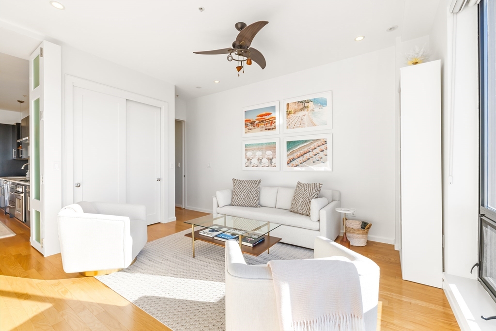 36 A Street, Unit 5C Boston, MA 02127 - Photo 12 of 25 a bedroom with a bed and a couch