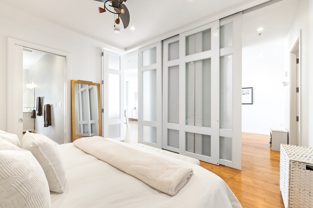 36 A Street, Unit 5C Boston, MA 02127 - Photo 16 of 25 a bedroom with a large bed and a window