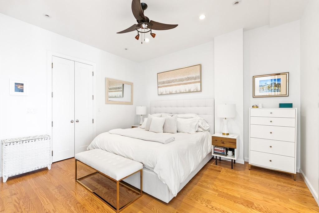 36 A Street, Unit 5C Boston, MA 02127 - Photo 17 of 25 a bedroom with a bed and a cabinets