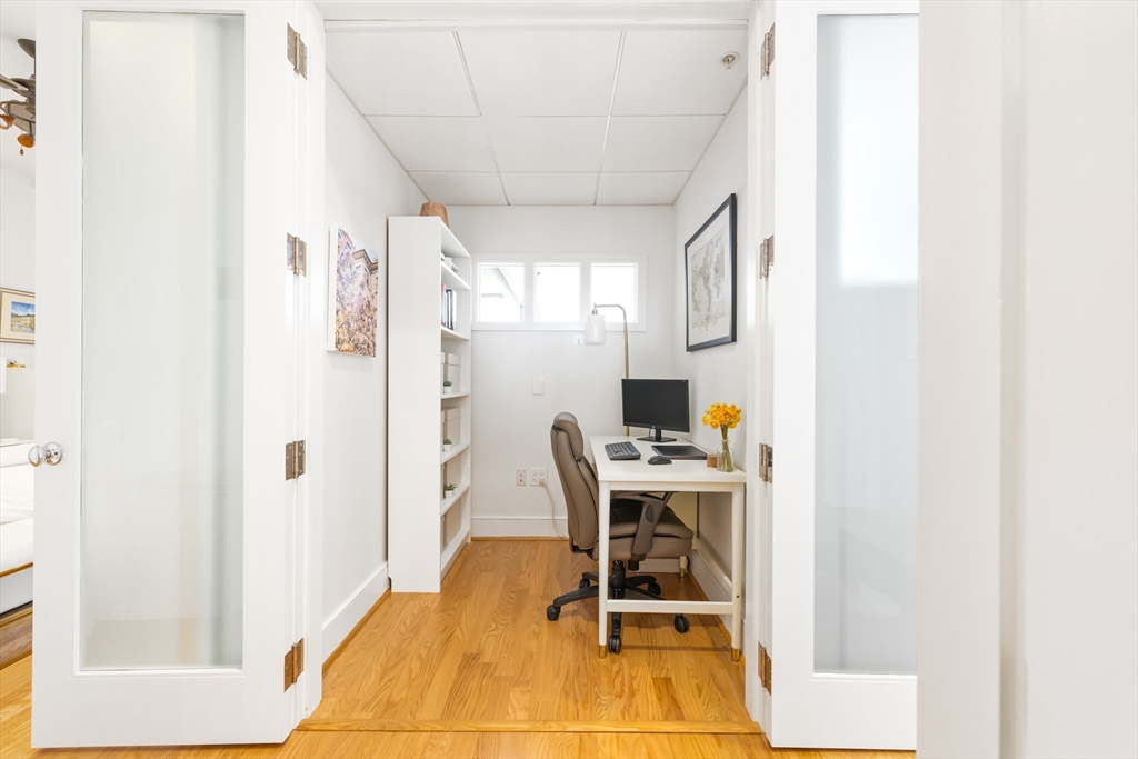 36 A Street, Unit 5C Boston, MA 02127 - Photo 19 of 25 a workspace with furniture and window