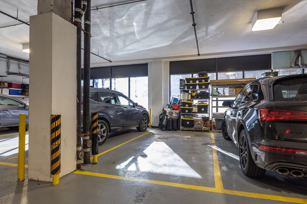 36 A Street, Unit 5C Boston, MA 02127 - Photo 22 of 25 a view of a garage with parked cars