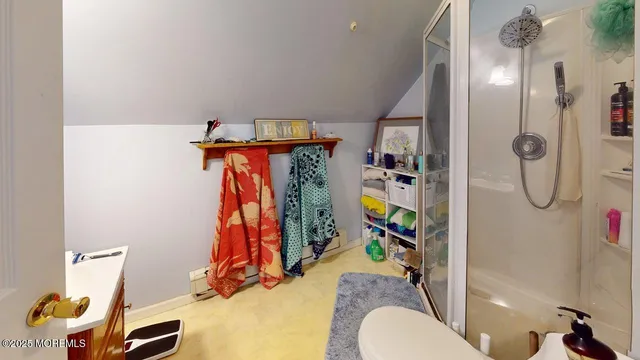 a view of a white house in a big yard with palm trees