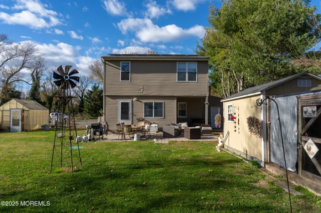 a front view of house with a garden and patio