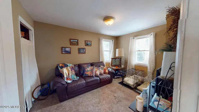 a bedroom with two beds and a large mirror