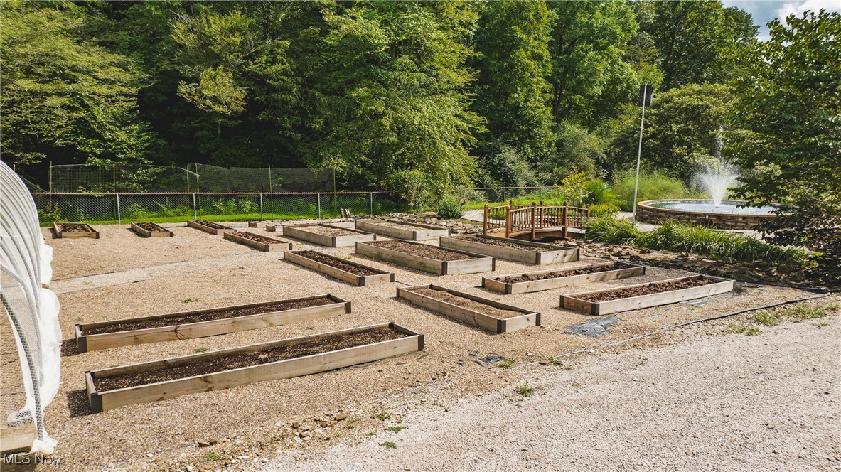 8089 Elk Fork Road Middlebourne, WV 26149 - Photo 42 of 50 15 Rasied Beds Located Berry Greenhouse & Fountain