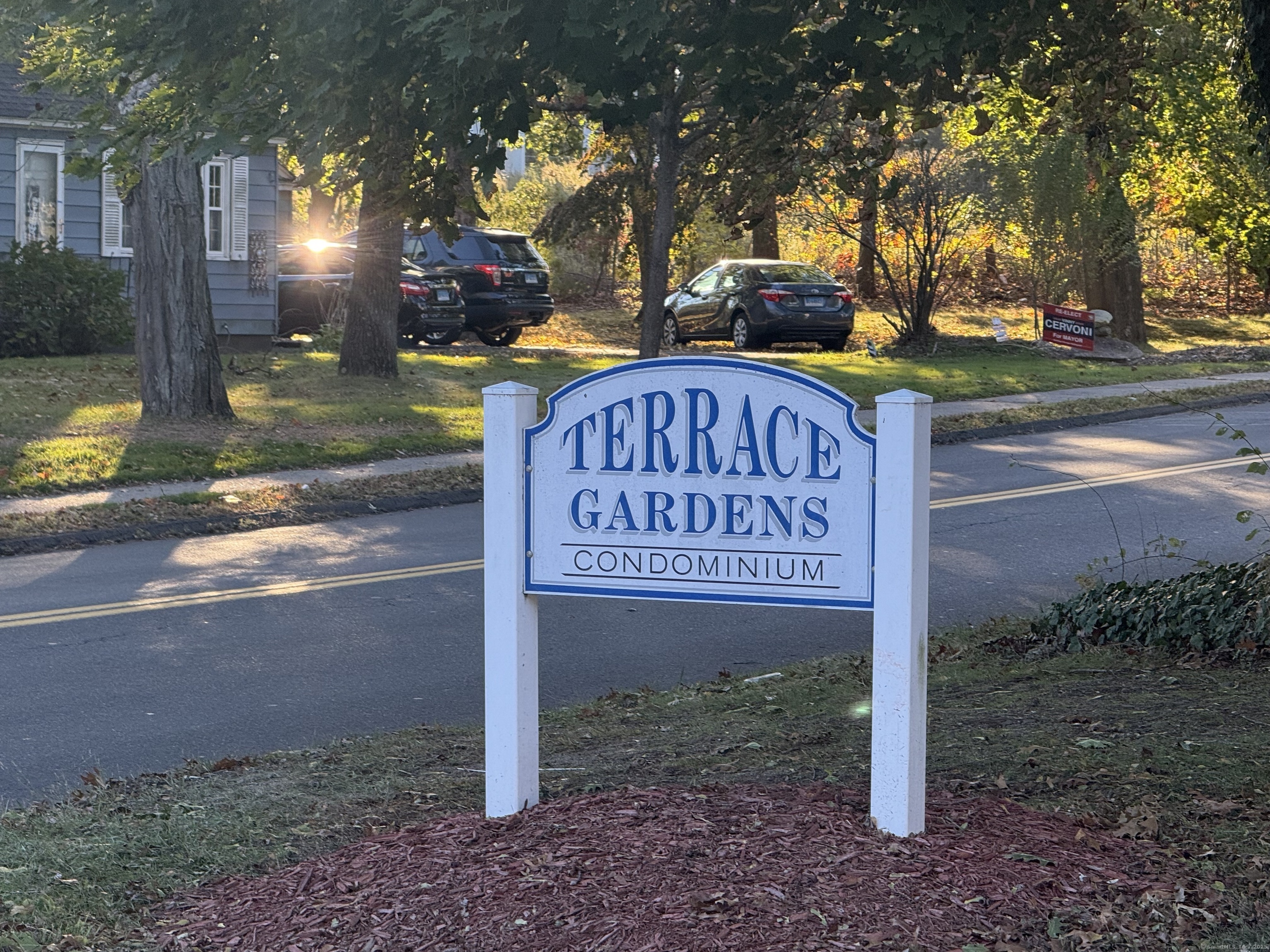 71 Terrace Gardens, Unit 71 Wallingford, CT 06492 - Photo 1 of 1 a view of a street sign under a large tree
