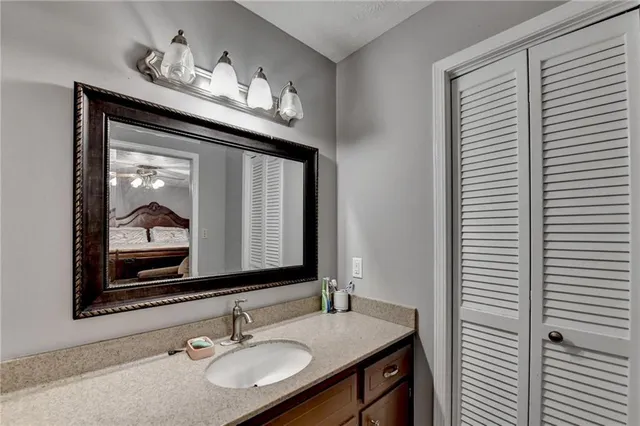 a bathroom with a sink and a mirror