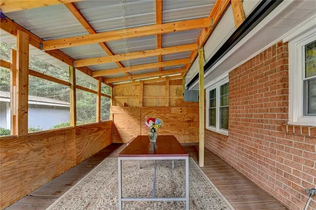 a view of a porch with furniture
