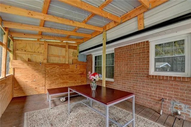 a backyard of a house with table and chairs