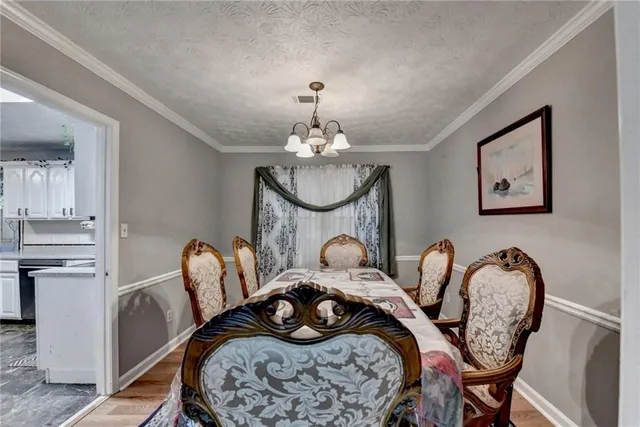 a bed room with furniture and a chandelier