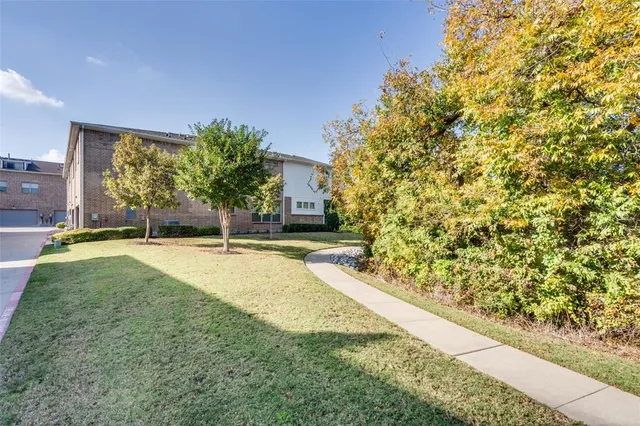 a view of yard with swimming pool and seating