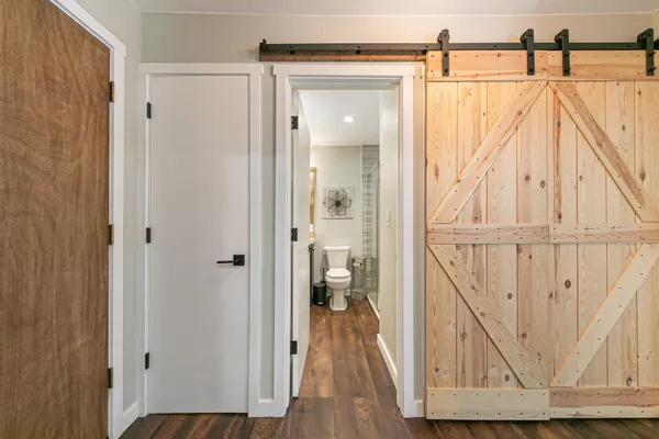 a view of walk in closet with wooden floor