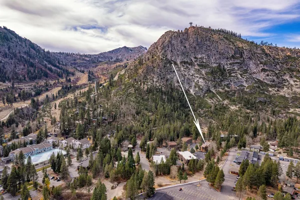 a view of a chairs and table in backyard
