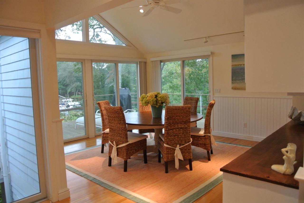 118 Wading Place Road Mashpee, MA 02649 - Photo 11 of 32 a view of a dining room with furniture window and outside view