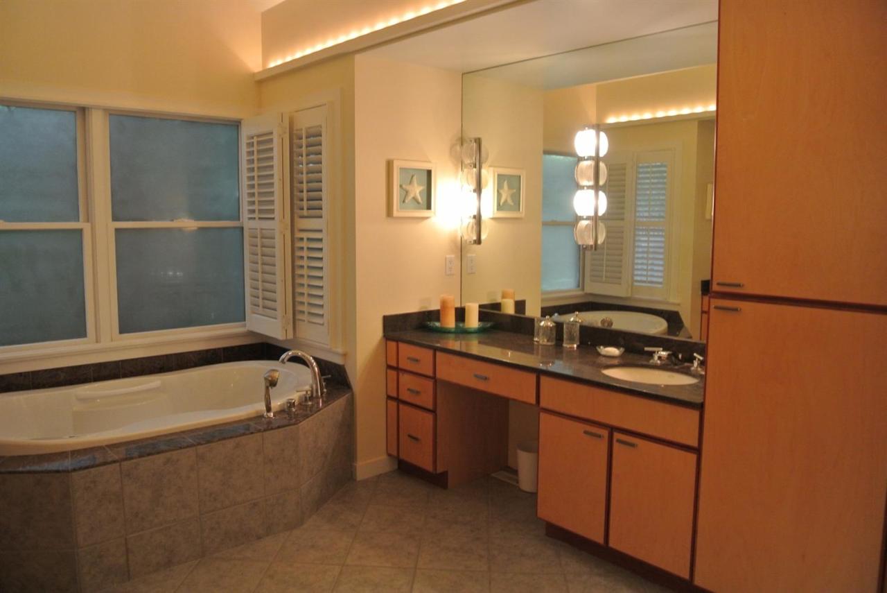 118 Wading Place Road Mashpee, MA 02649 - Photo 26 of 32 a bathroom with a tub sink and mirror