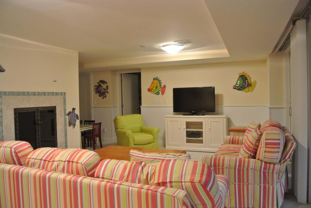 118 Wading Place Road Mashpee, MA 02649 - Photo 28 of 32 a bedroom with two bed and a television