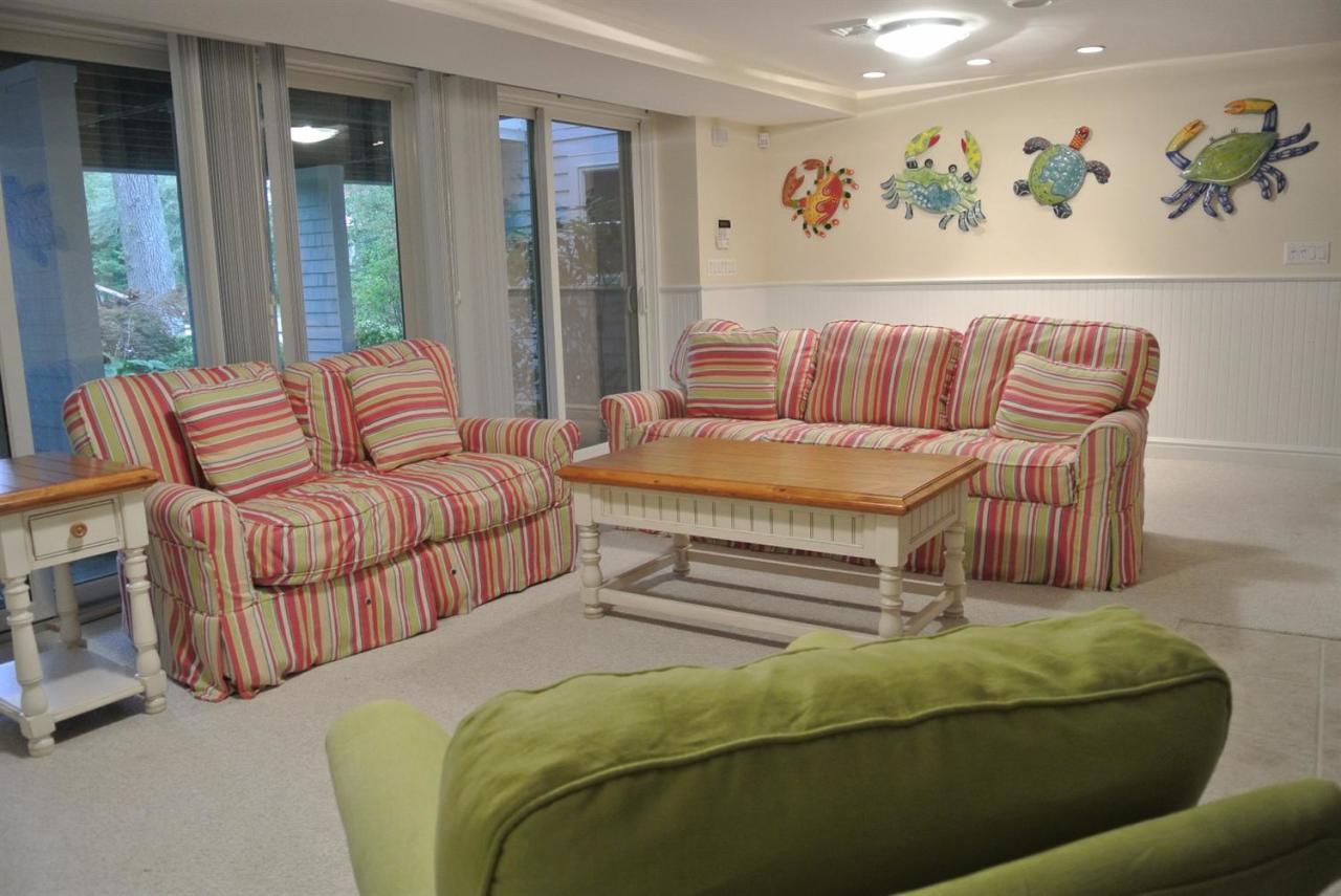 118 Wading Place Road Mashpee, MA 02649 - Photo 31 of 32 a bedroom with furniture and a large window